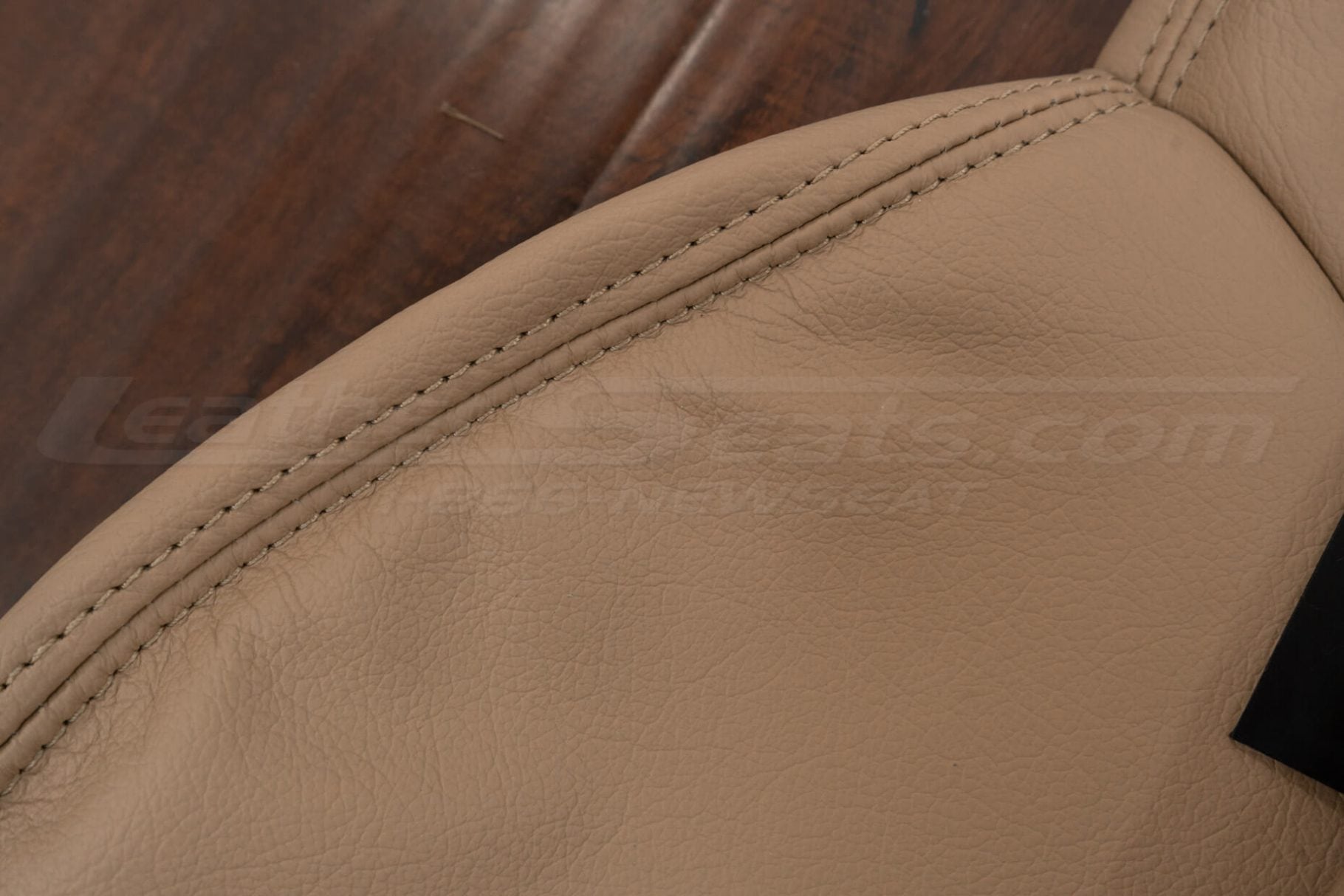 Bisque double-stitching close-up on bisque leather