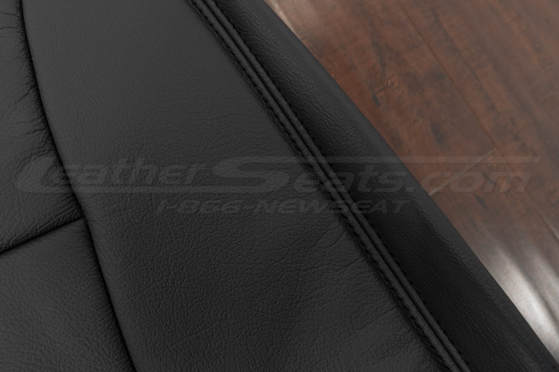 Close-up of Dark Graphite double-stitching on dark graphite leather