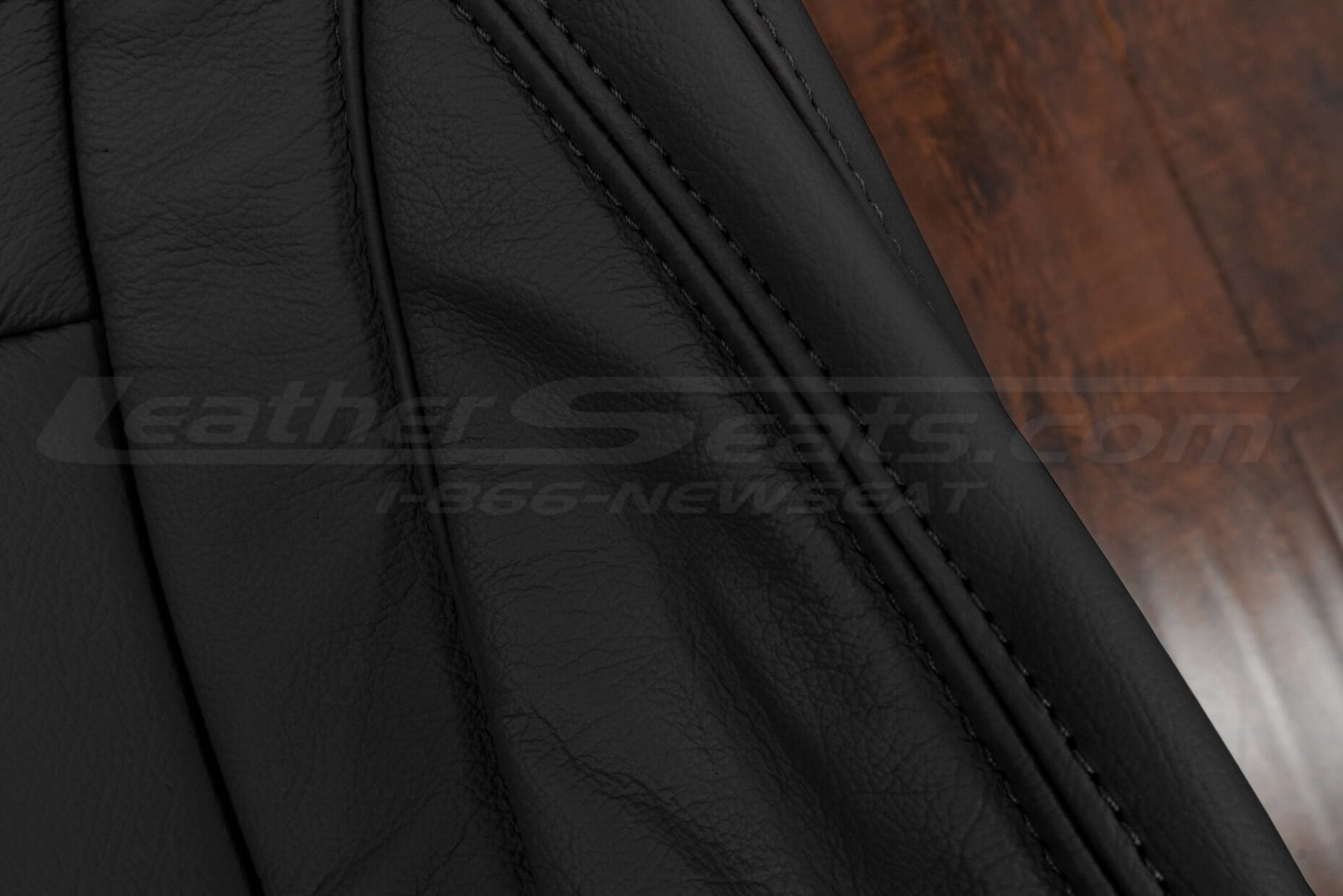 Black double-stitching on Black leather