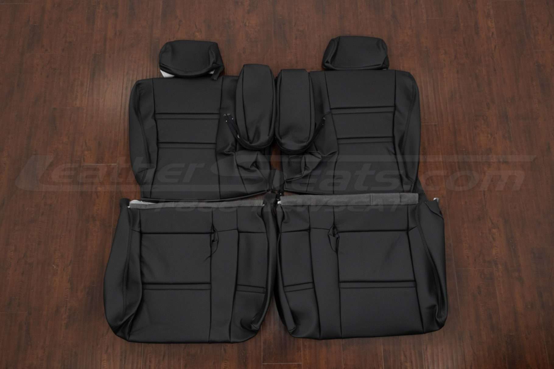 1994-1997 Toyota Landcruiser aftermarket seat covers in black - middle row with armrests
