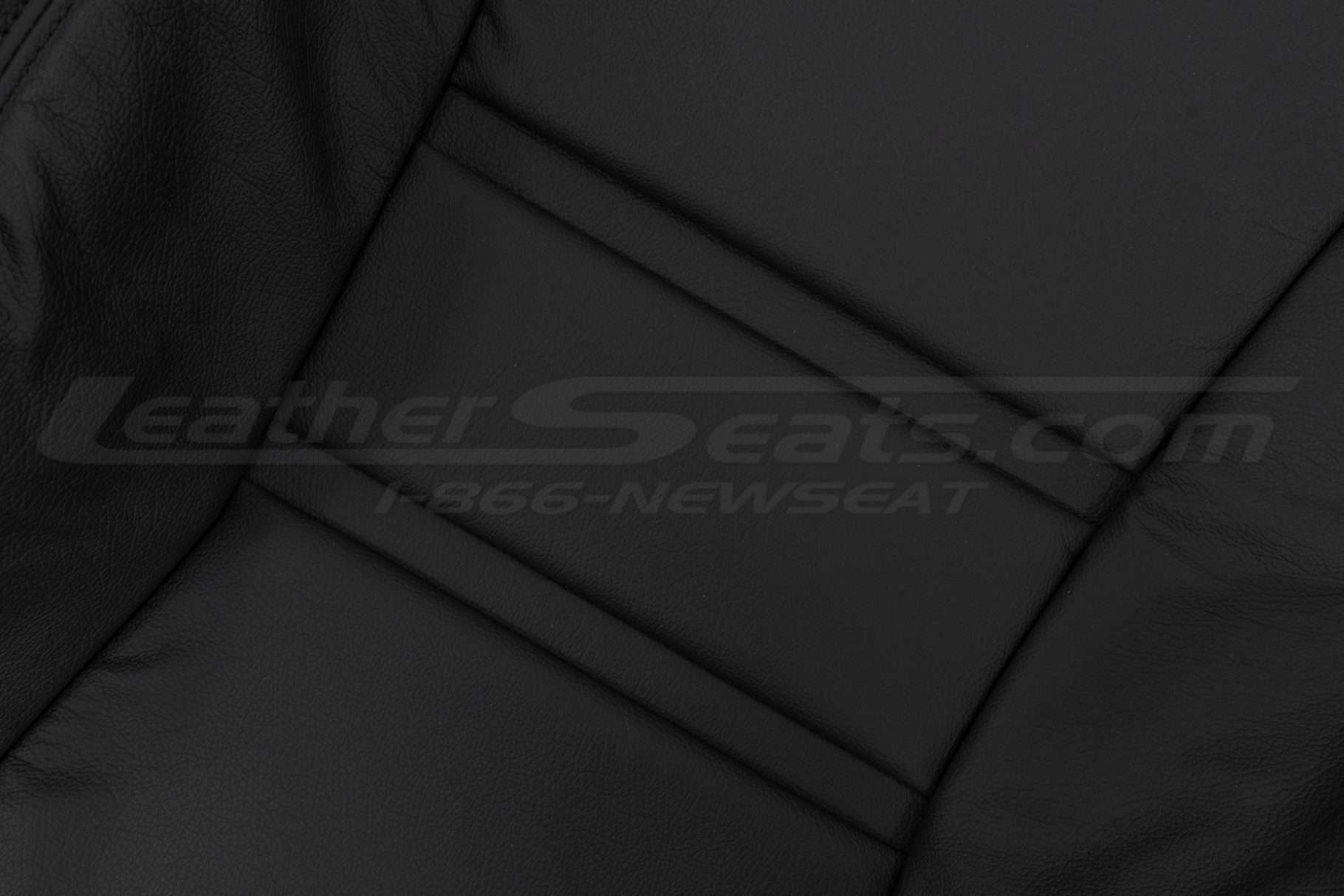 Black leather backrest leather texture close-up