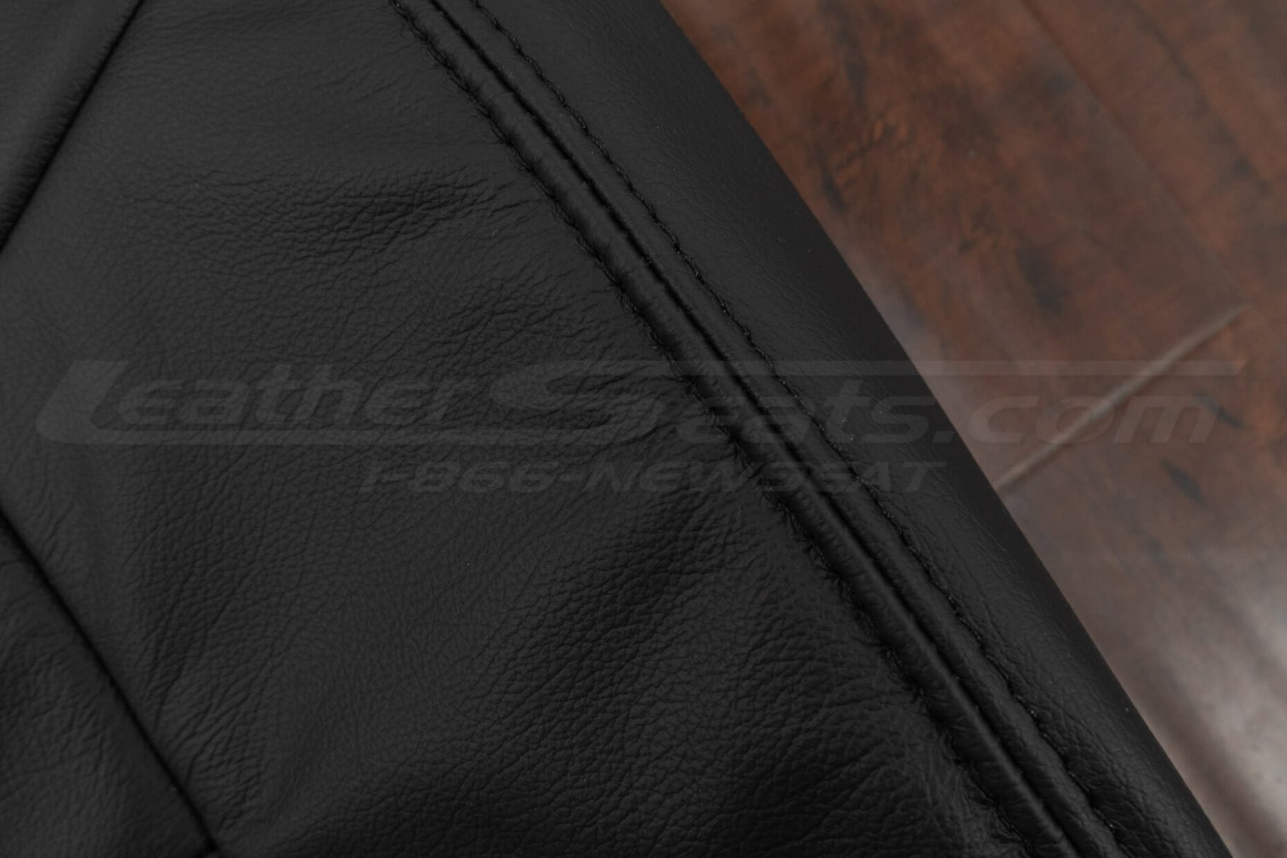 Black matching double stitching on black leather