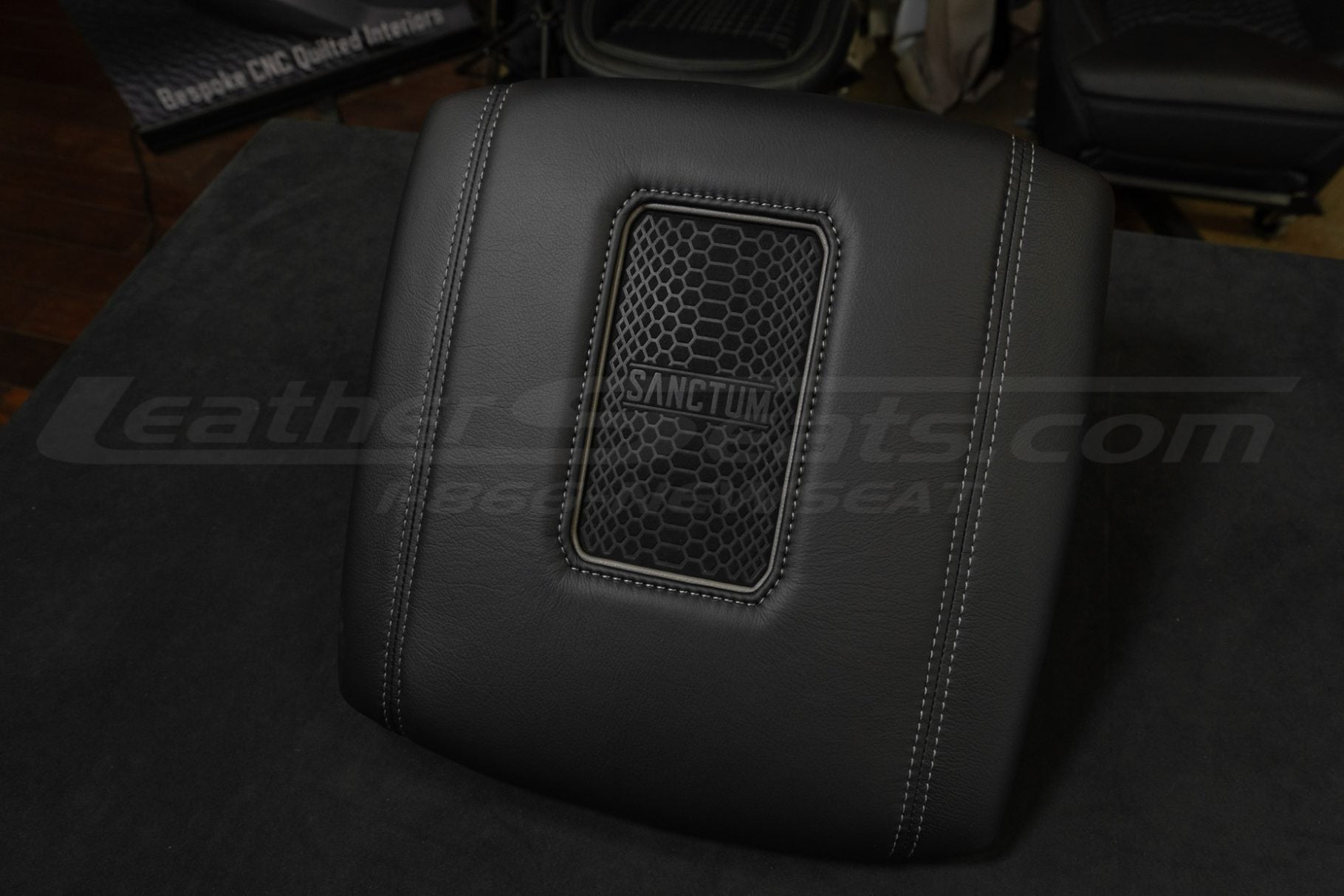 Side view of wireless charging center console lid for dodge ram trucks