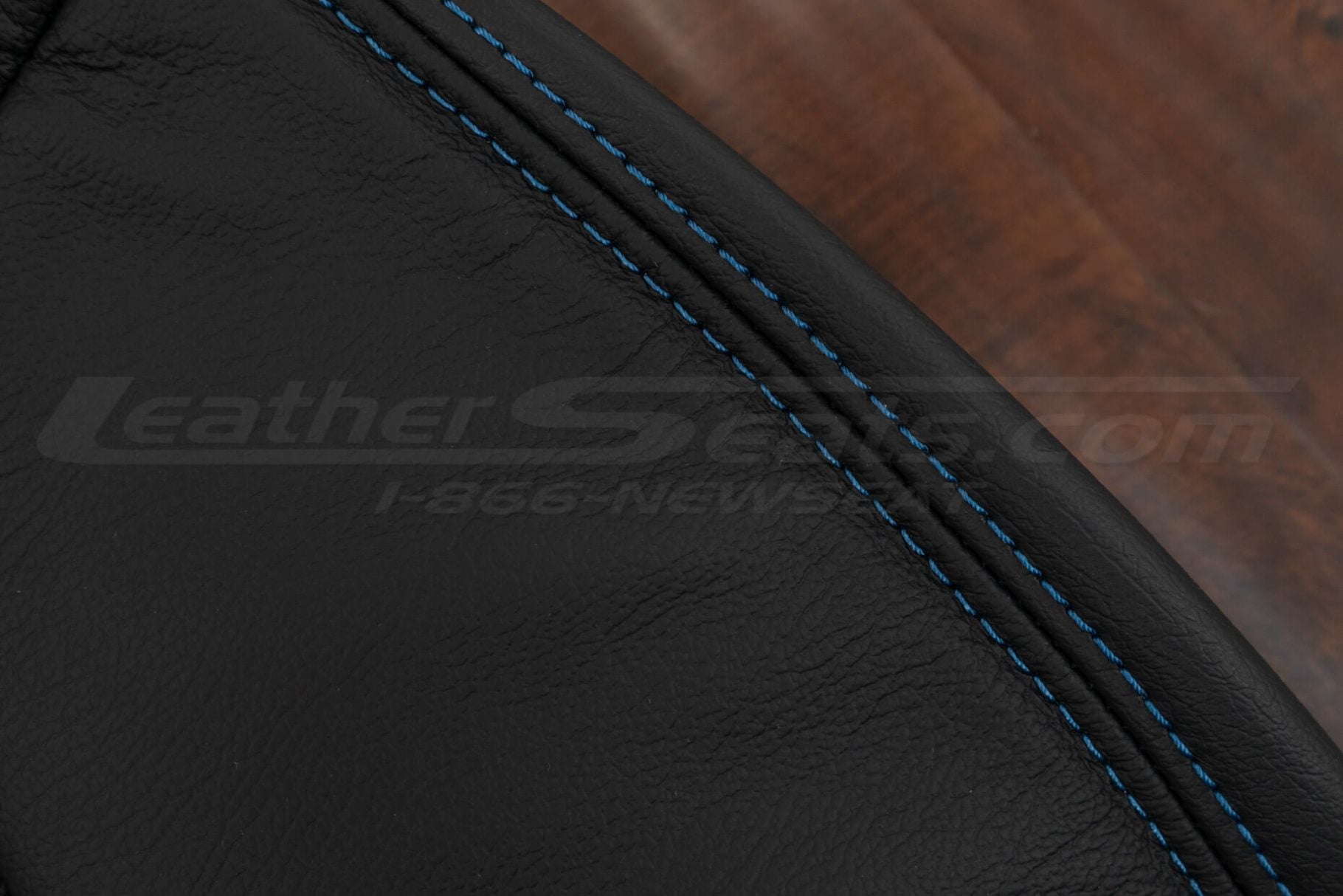 Contrasting Cobalt blue double stitching on black leather