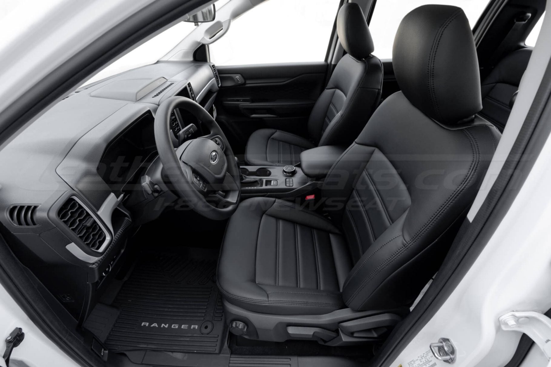 Ford Ranger Crew Cab with aftermarket leather seat covers installed