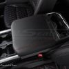 Black center console lid cover with red stitching