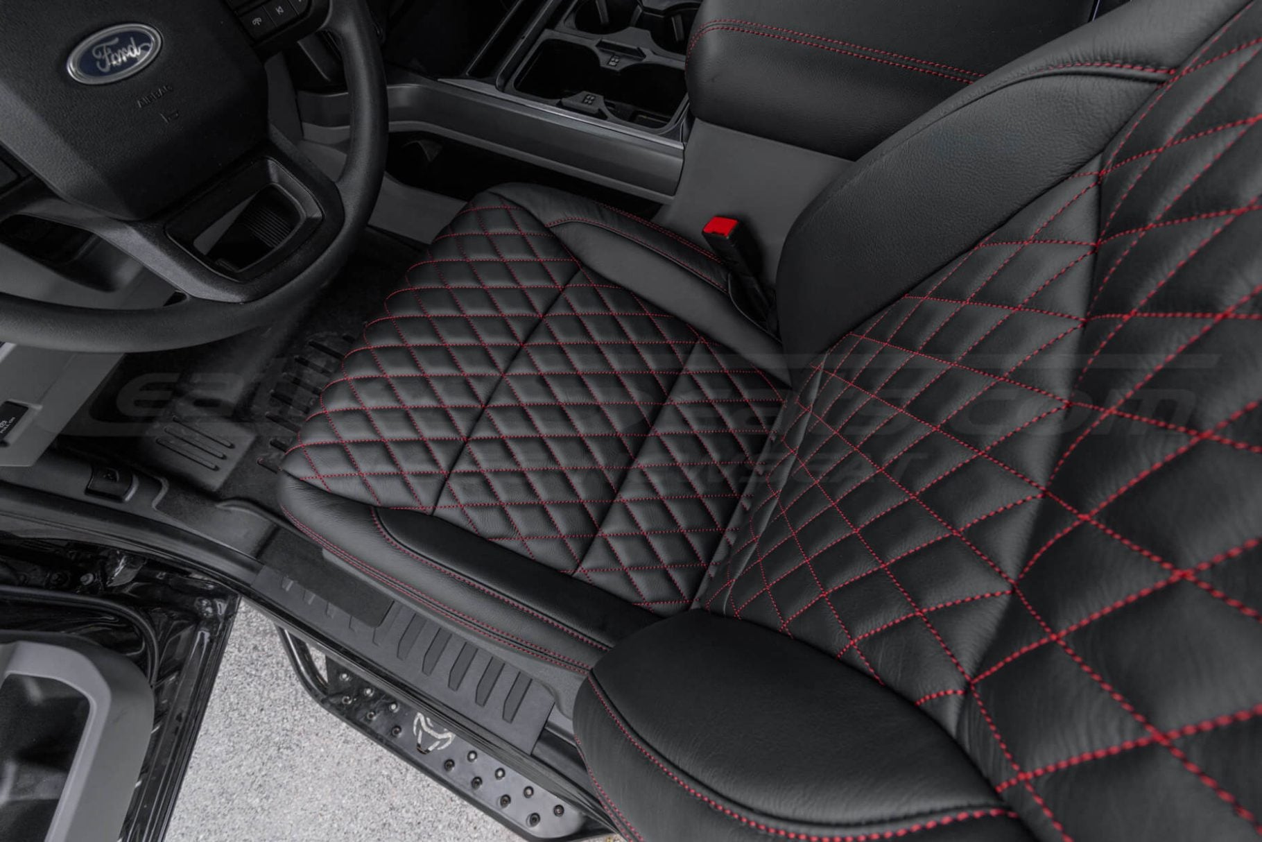Top-down view of diamond quilted aftermarket leather seats installed