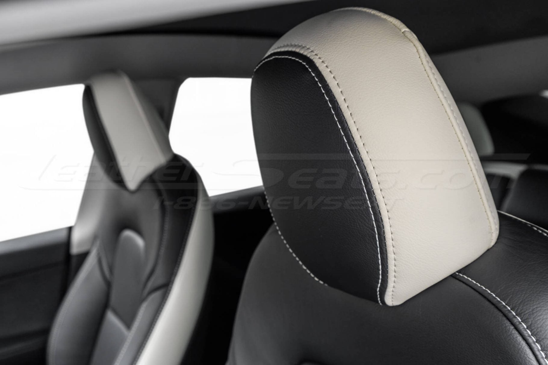 Tesla Model Y two-tone leather headrest close-up