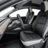 2023-2024 Tesla Model Y with aftermarketr white and black leather seat covers installed