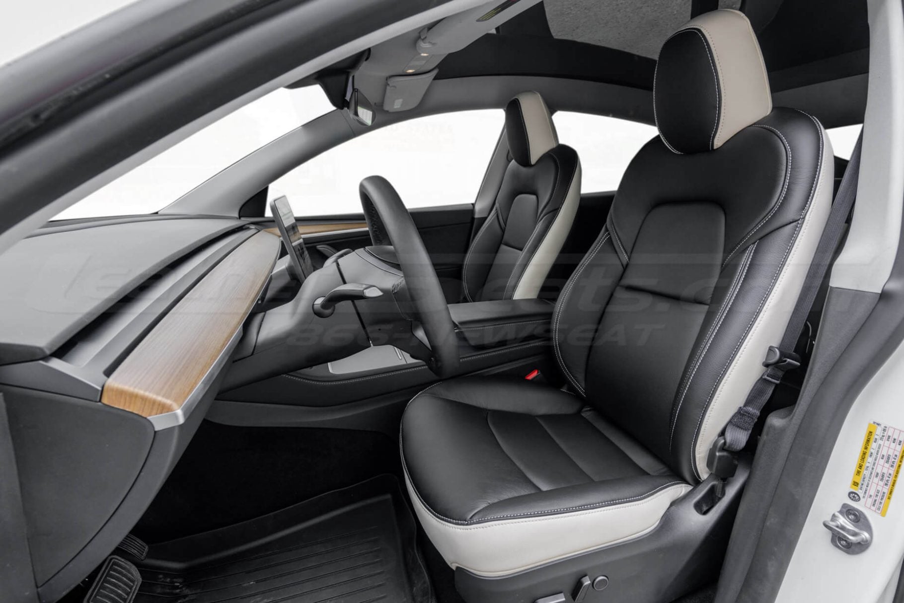 2023-2024 Tesla Model Y with aftermarketr white and black leather seat covers installed