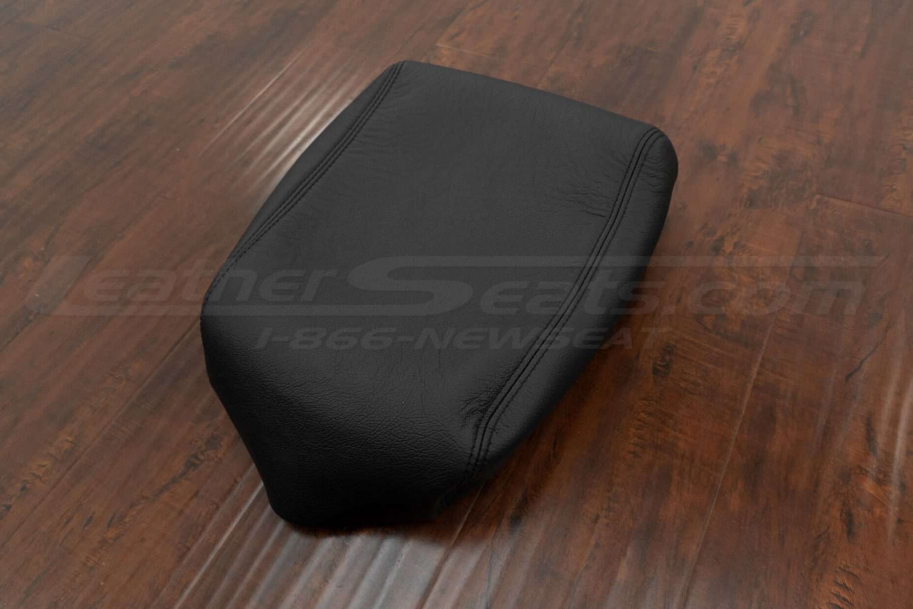 ford black center console lid upholstery with black stitching