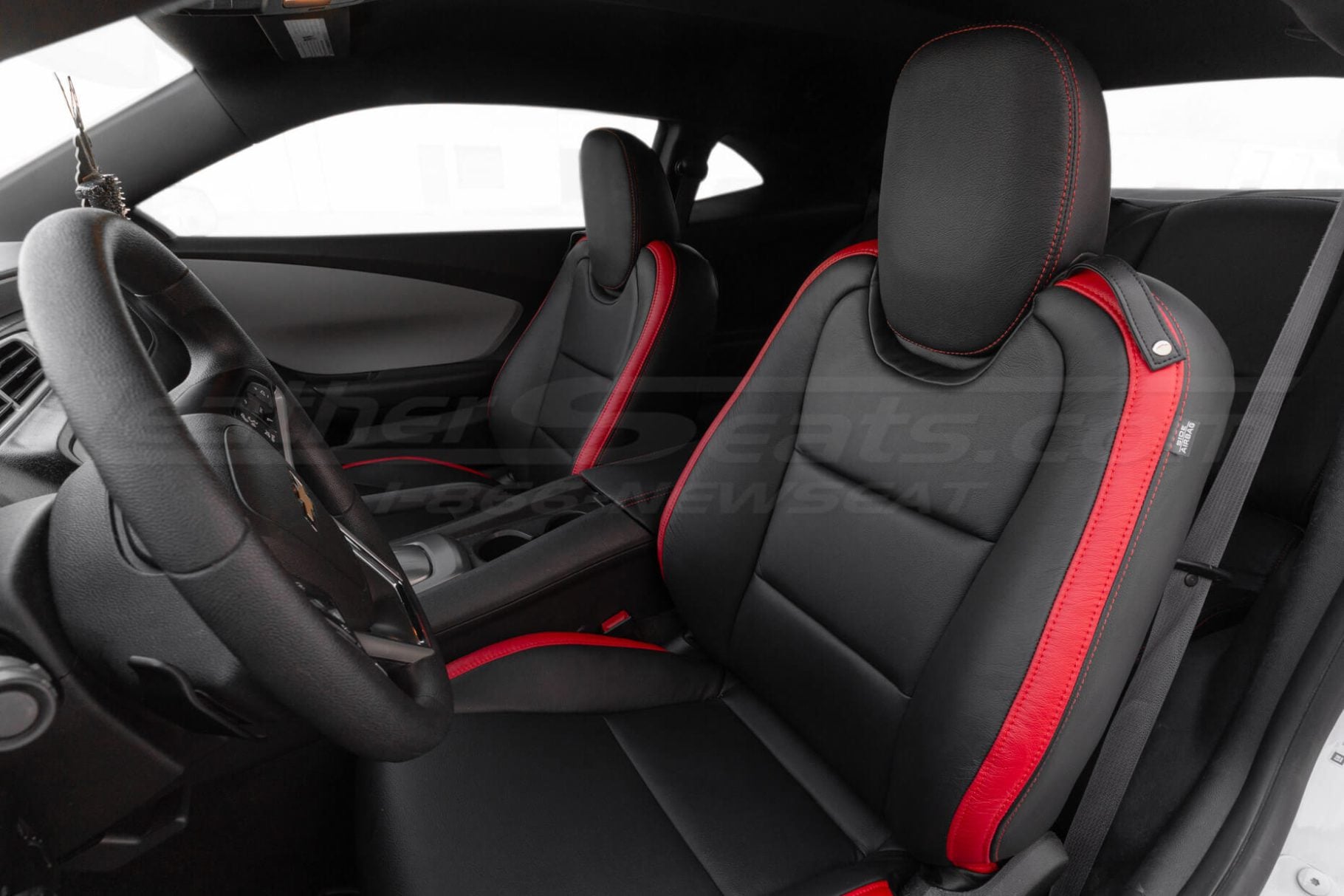 Chevrolet Camaro interior with black leather seats and red accents