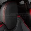 Close-up of Chevrolet Camaro black leather headrest with red stitching