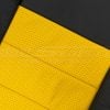 Perforated yellow insert section leather texture close-up