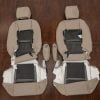 Underside view of beige front seat upholstery covers for Lexus RX series, showing installation foam backing and attachment points for driver and passenger sides.