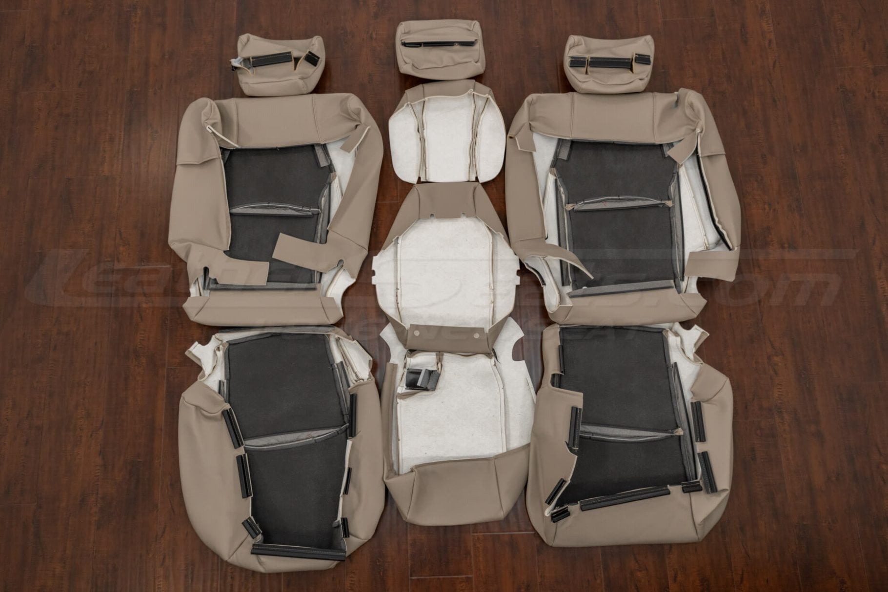 Underside view of Ivory leather rear seat upholstery kit for Lexus RX series, showing foam backing, Velcro attachment strips, and stitching layout for headrests, armrest, and seat sections.