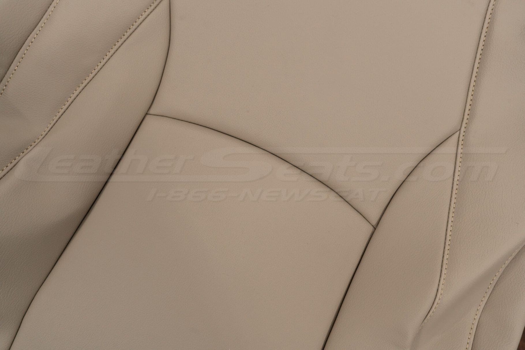 Detailed view of Ivory leather texture and seam work on Lexus RX front seat backrest cover, highlighting grain variation
