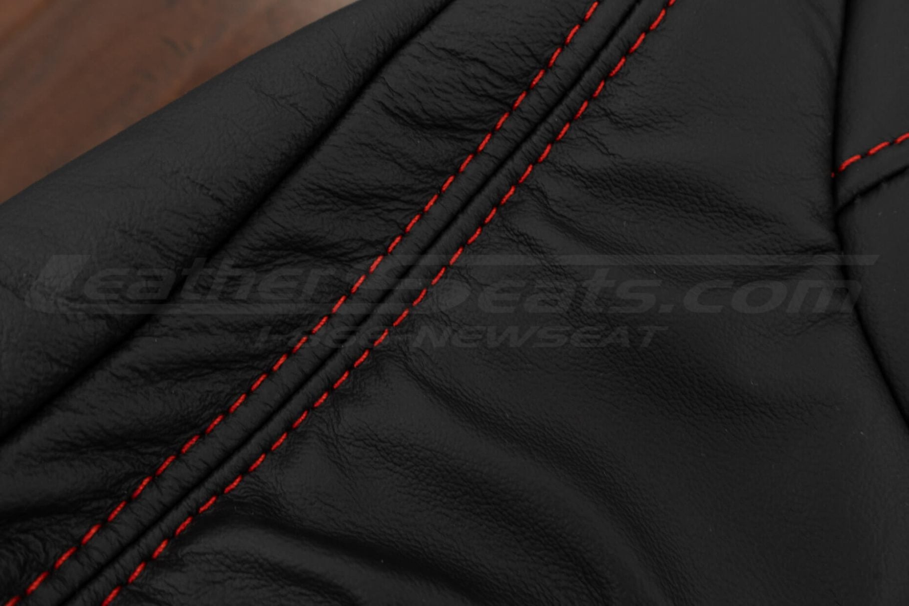 Contrasting Bright red double-stitching on Black leather