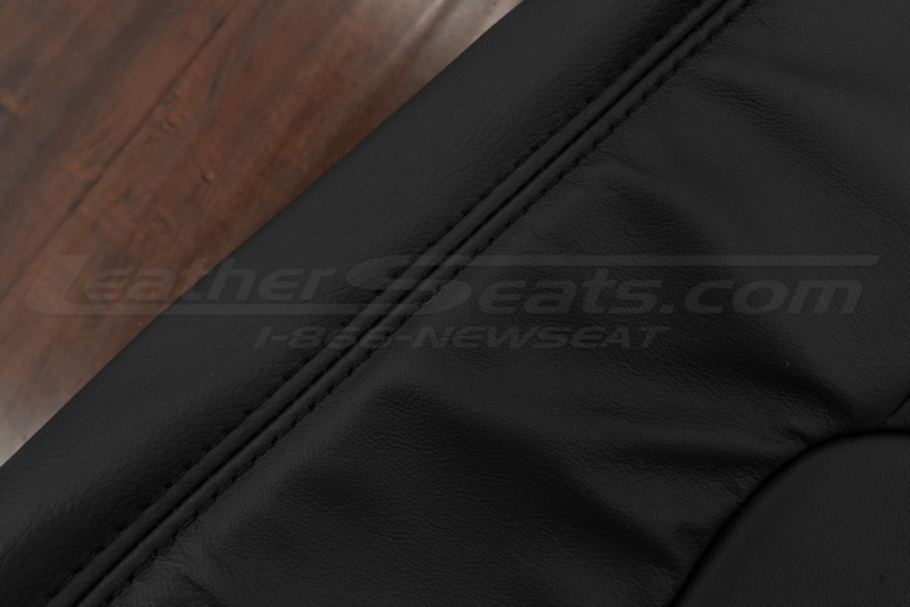 Black double-stitching on Black leather