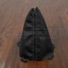 Front stitching view of black leather shift boot with lapis gray stitching