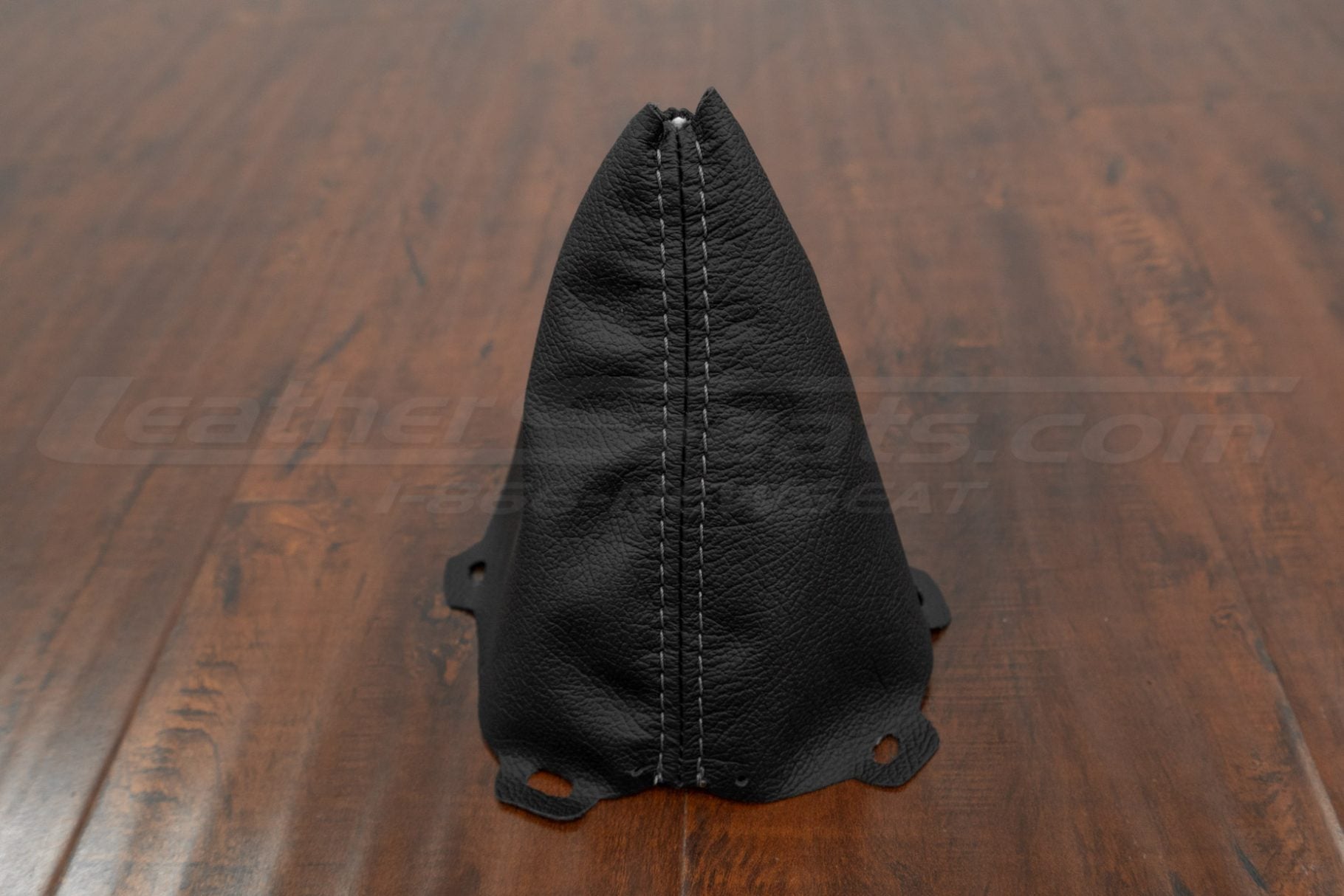 Front stitching view of black leather shift boot with lapis gray stitching