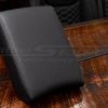 Black leather console lid cover for 2017–2022 Honda CR-V on rustic wooden surface.