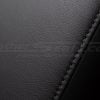 Stone stitching on black leather console cover