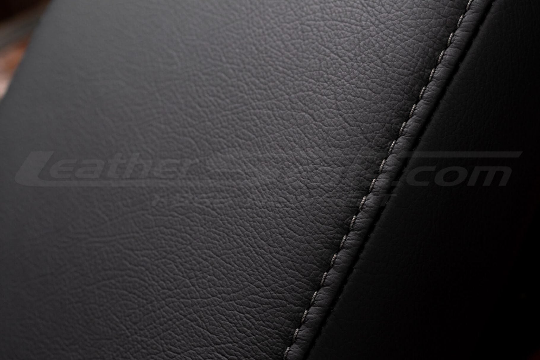 Stone stitching on black leather console cover