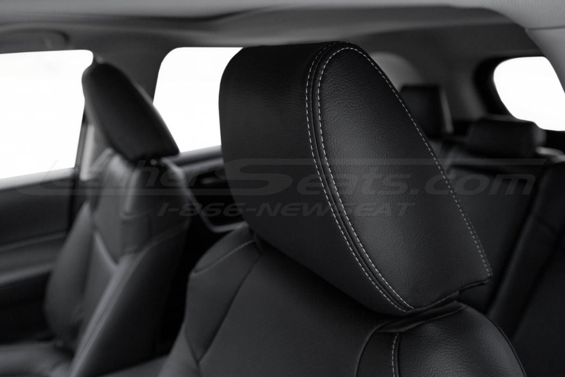 RAV4 SUV black leather headrest with contrasting dove grey/white double stitching