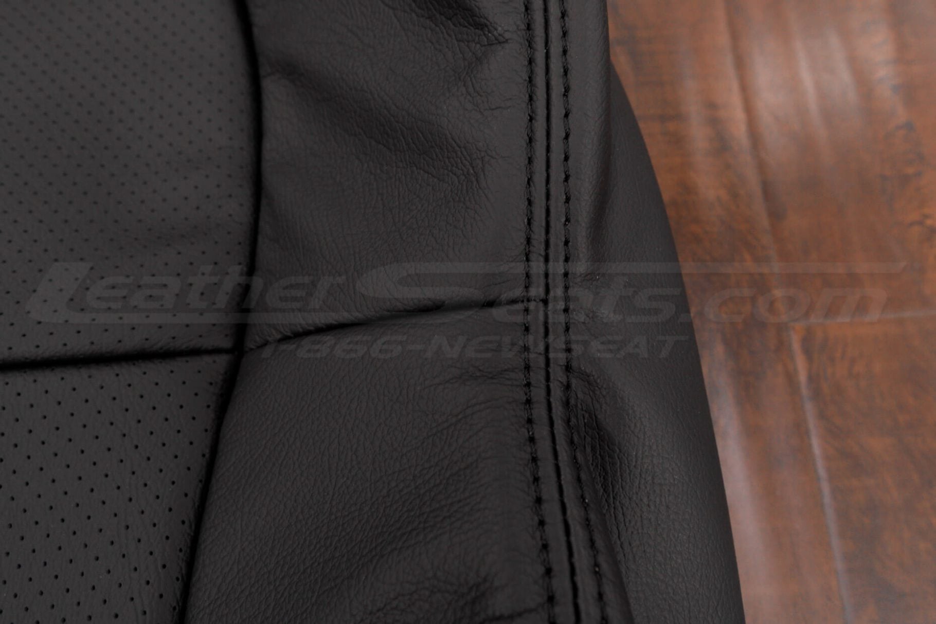 Black double-stitching on matching Black leather