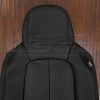 Upper section of black leather backrest cover