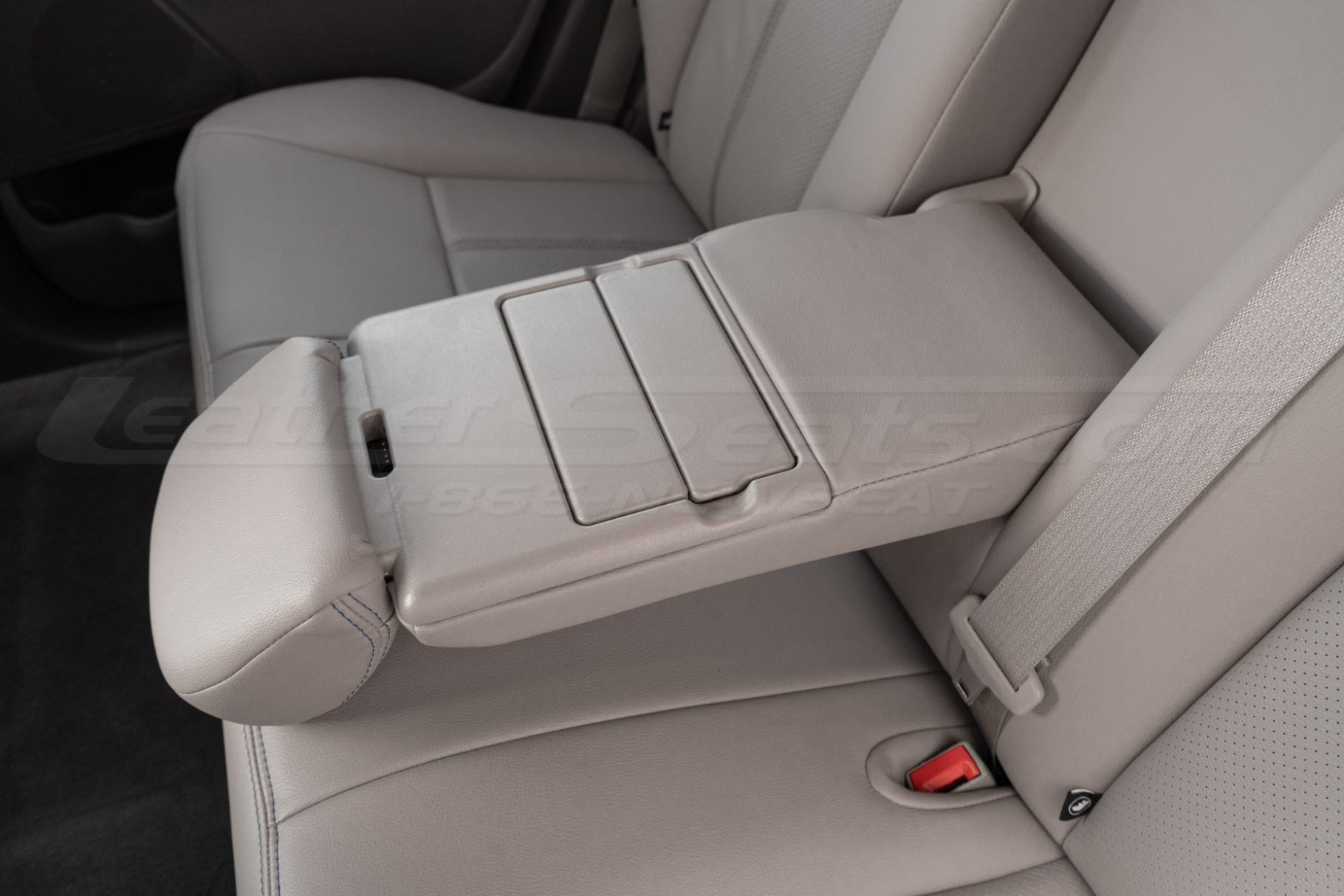 Folded down Ford Edge center armrest close-up