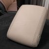 Side view of Escalade center armrest cover witth contrast stitching