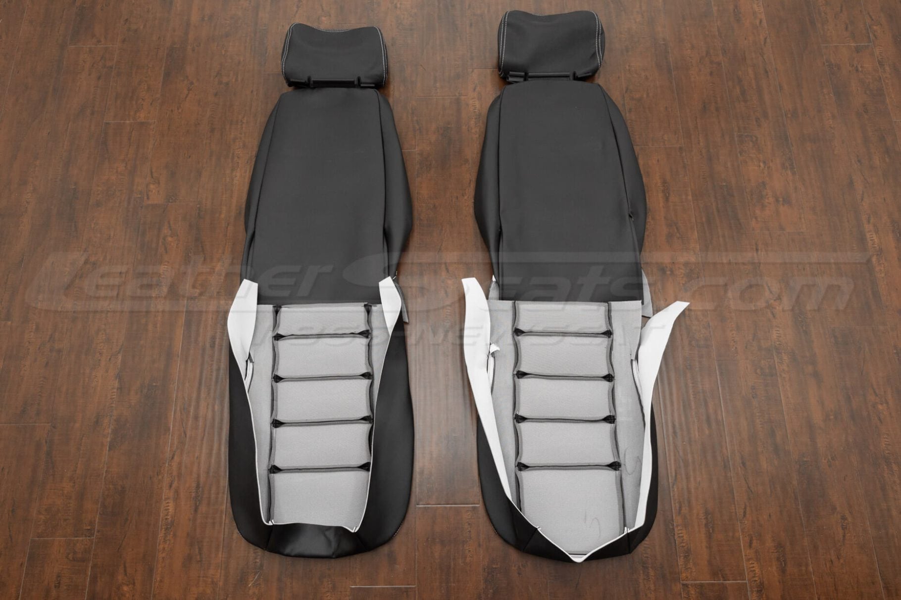 Hummer H1 2 Row black leather seat upholstery - front seat covers flipped