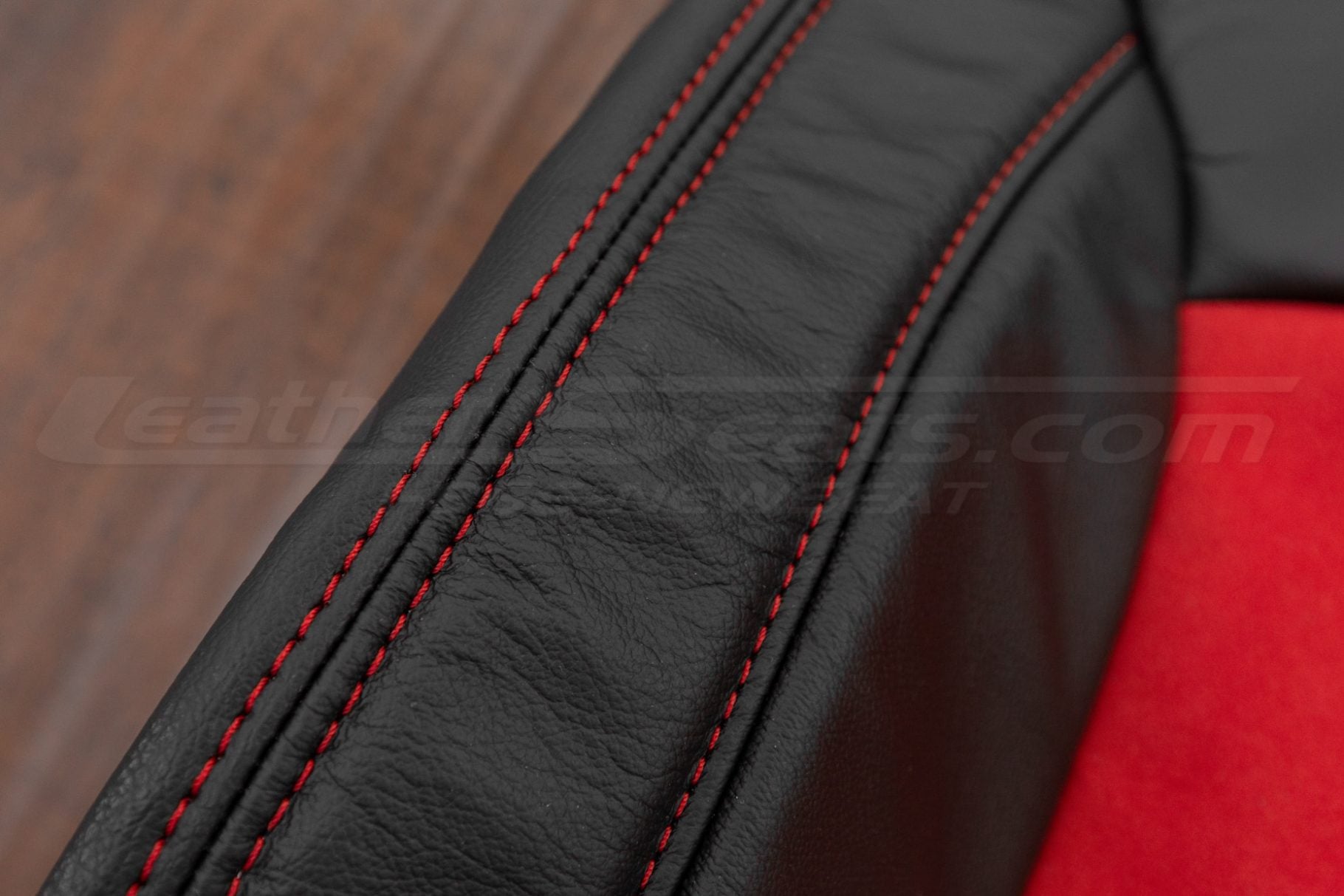Contrasting Red stitching on black leather