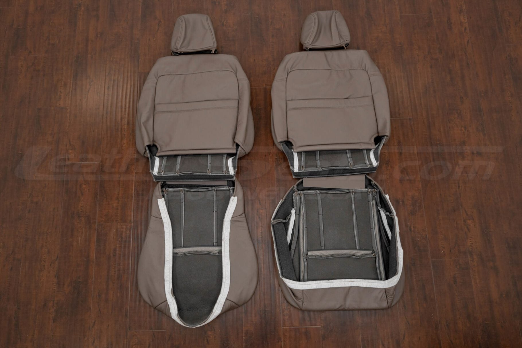 Front seat leather upholster flipped showing seat cover attachments
