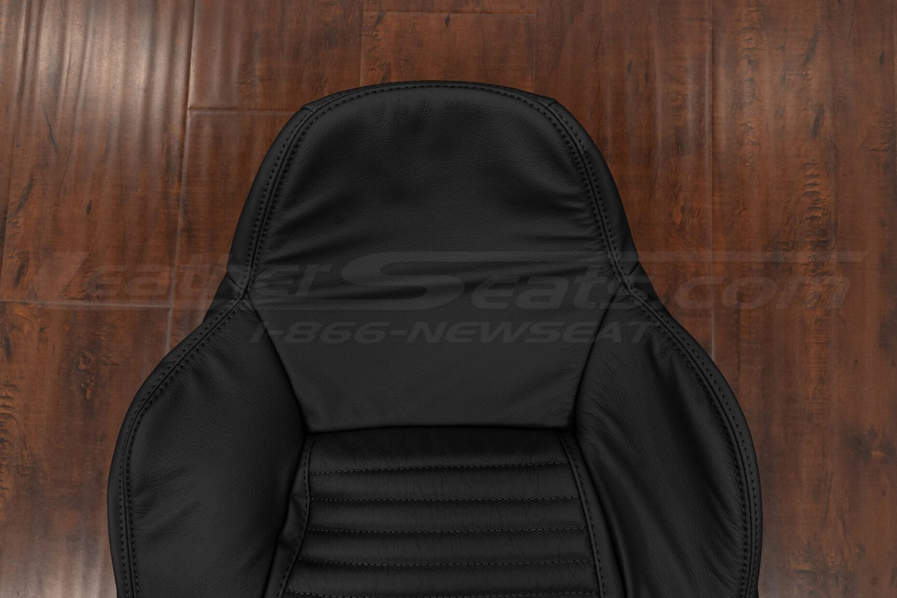 Headrest section of black c4 corvette uphosltery