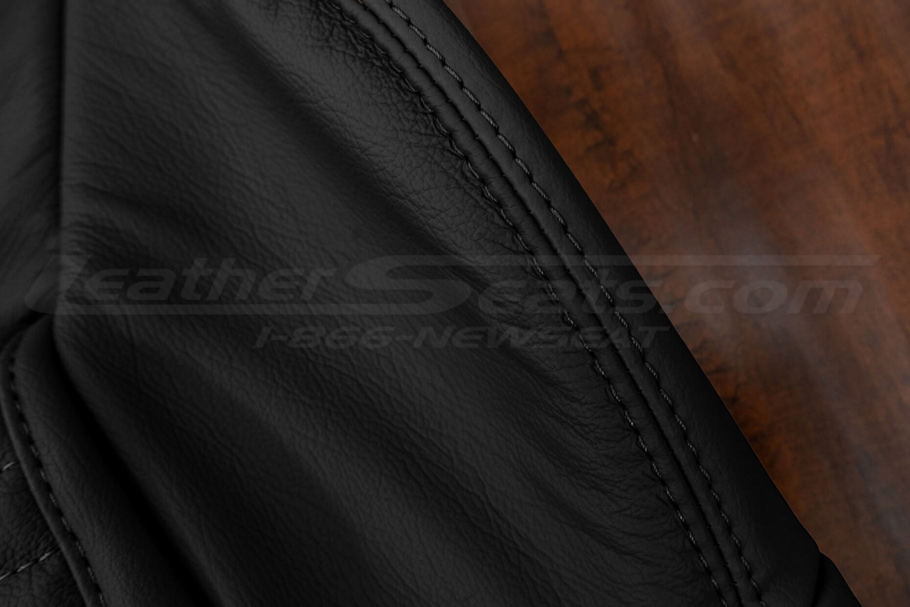 Black double stitching on matching black leather