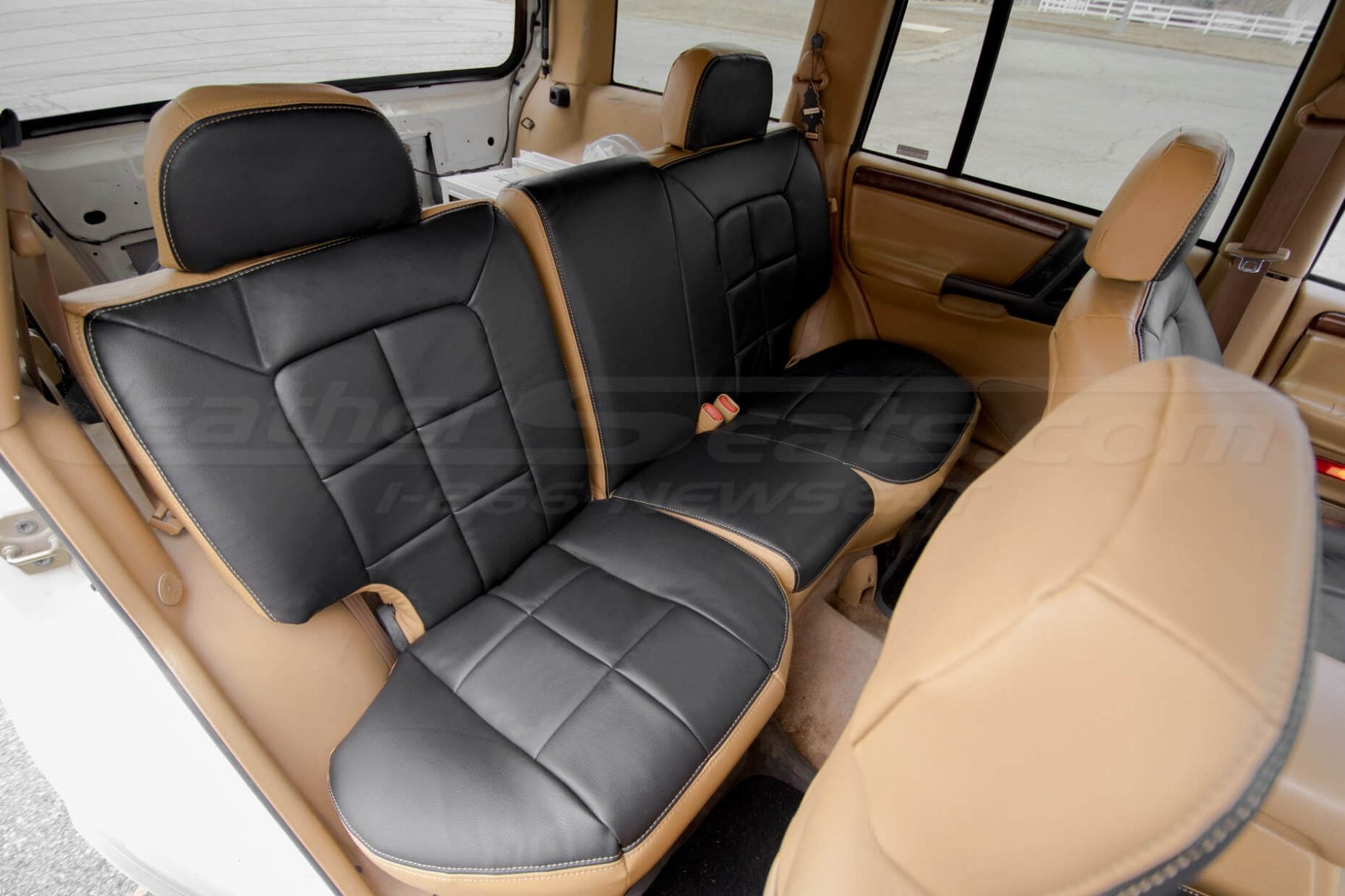Rear seat ldoeskin and black leather upholstery installed for grand cherokee suv - rear seatss passenger side