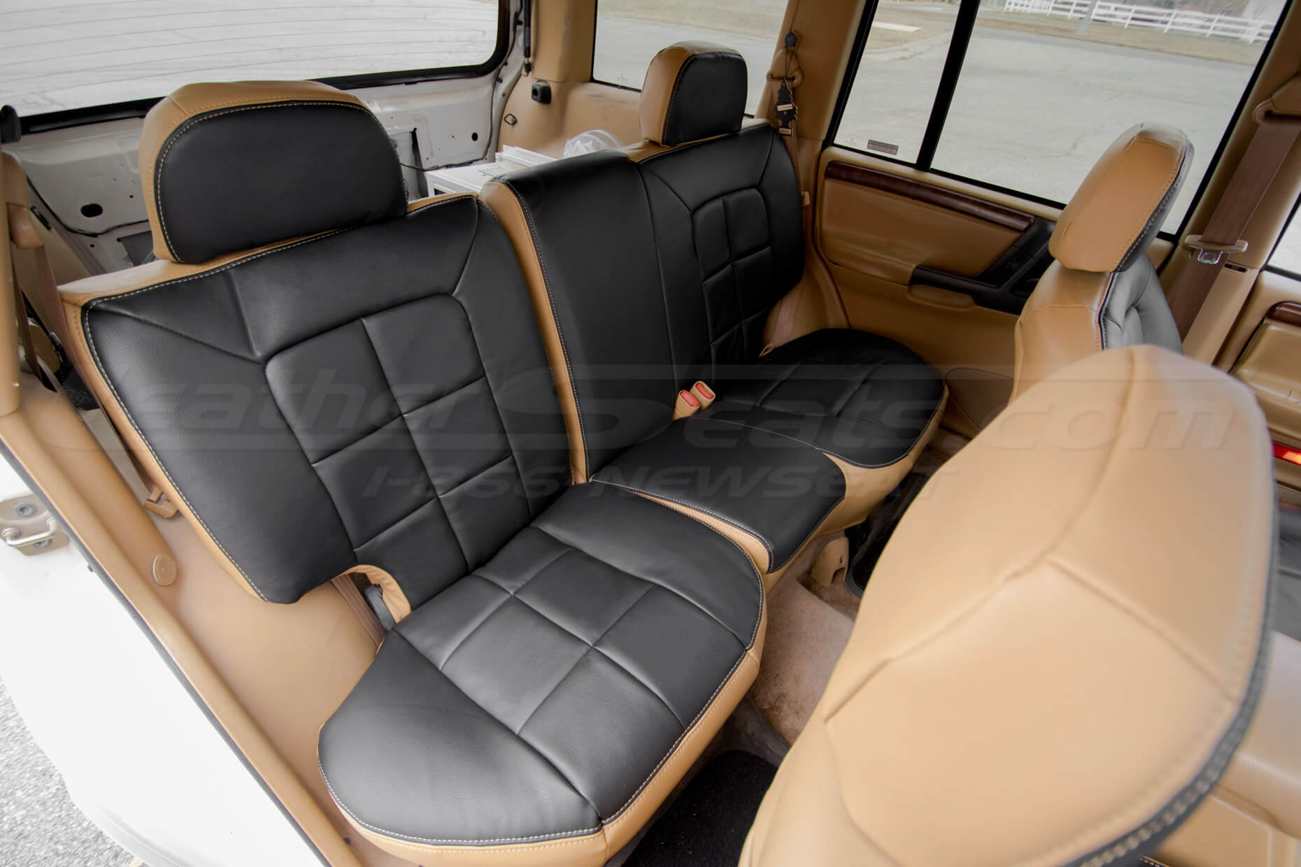Rear seat ldoeskin and black leather upholstery installed for grand cherokee suv - rear seatss passenger side
