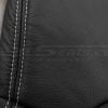 Silver double-stitching on black leather