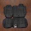 2006-2010 Hummer H3 Black leather seat covers - rear sat uphosltery