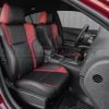 Aftermarket black and red leather seat covers installed in 2015-2023 Dodge Charger