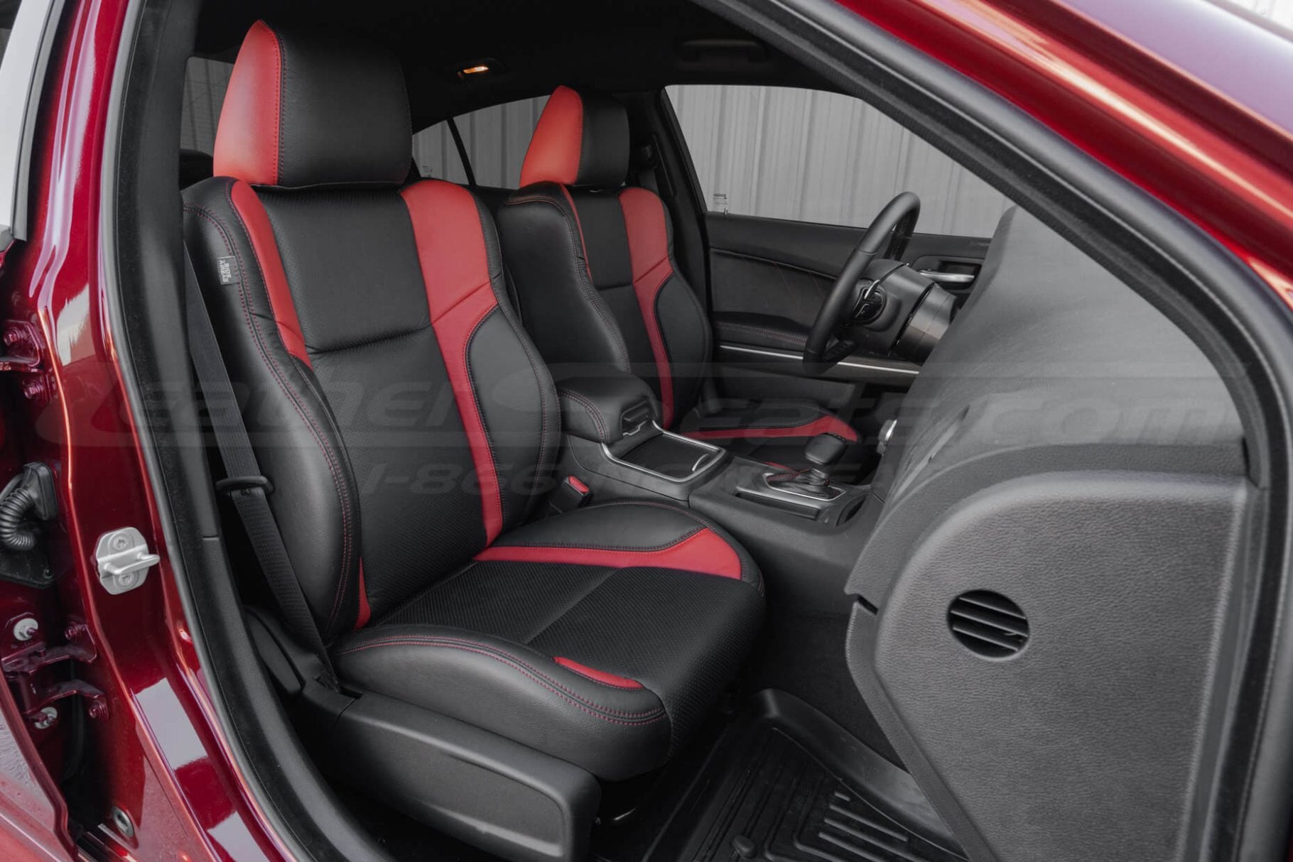 Aftermarket black and red leather seat covers installed in 2015-2023 Dodge Charger