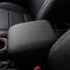 Driver side view of aftermarket leather center console covver for toyota tacoma