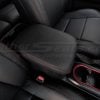 Black Toyota Tacoma leather console lid with contrast red stitching