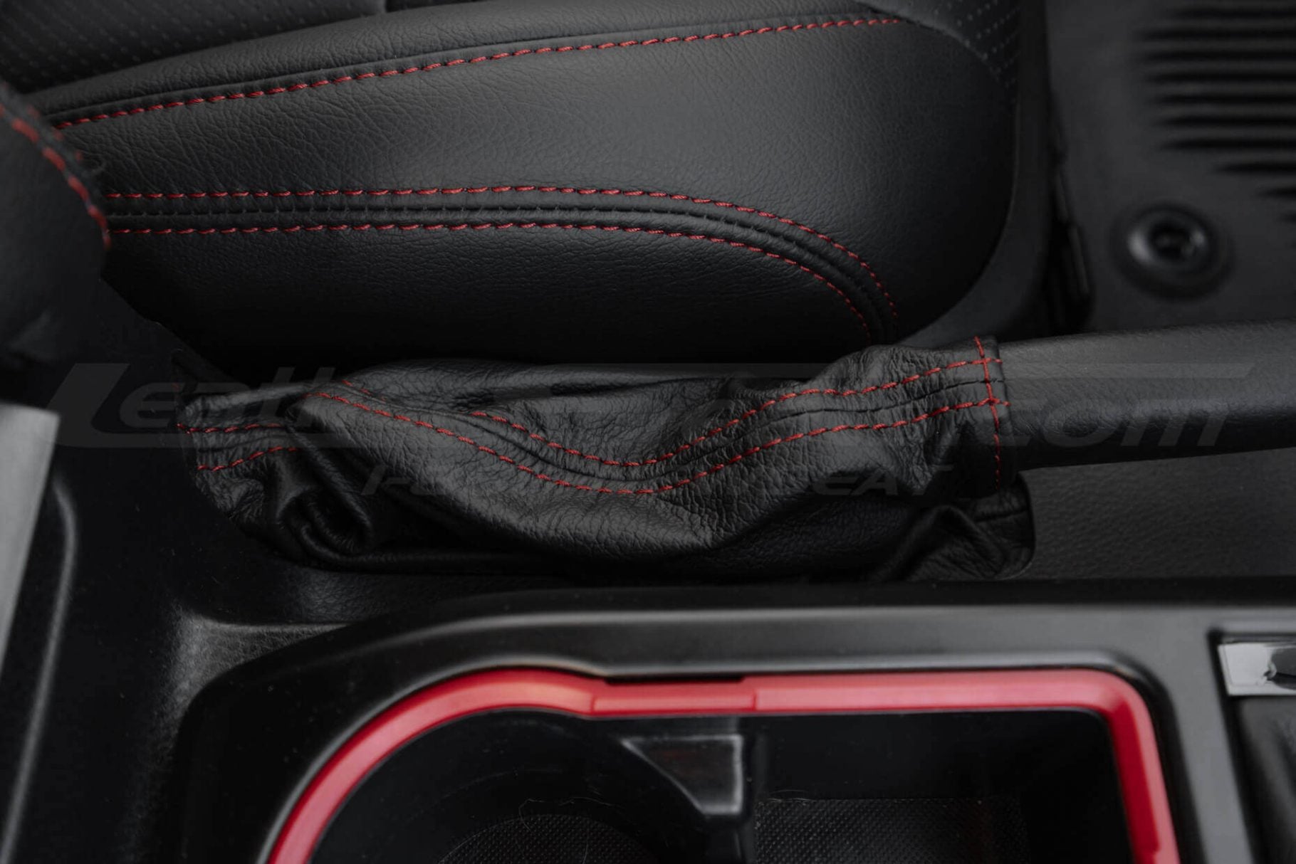 Close-up of black emergeny break upholstery for toyota tacoma
