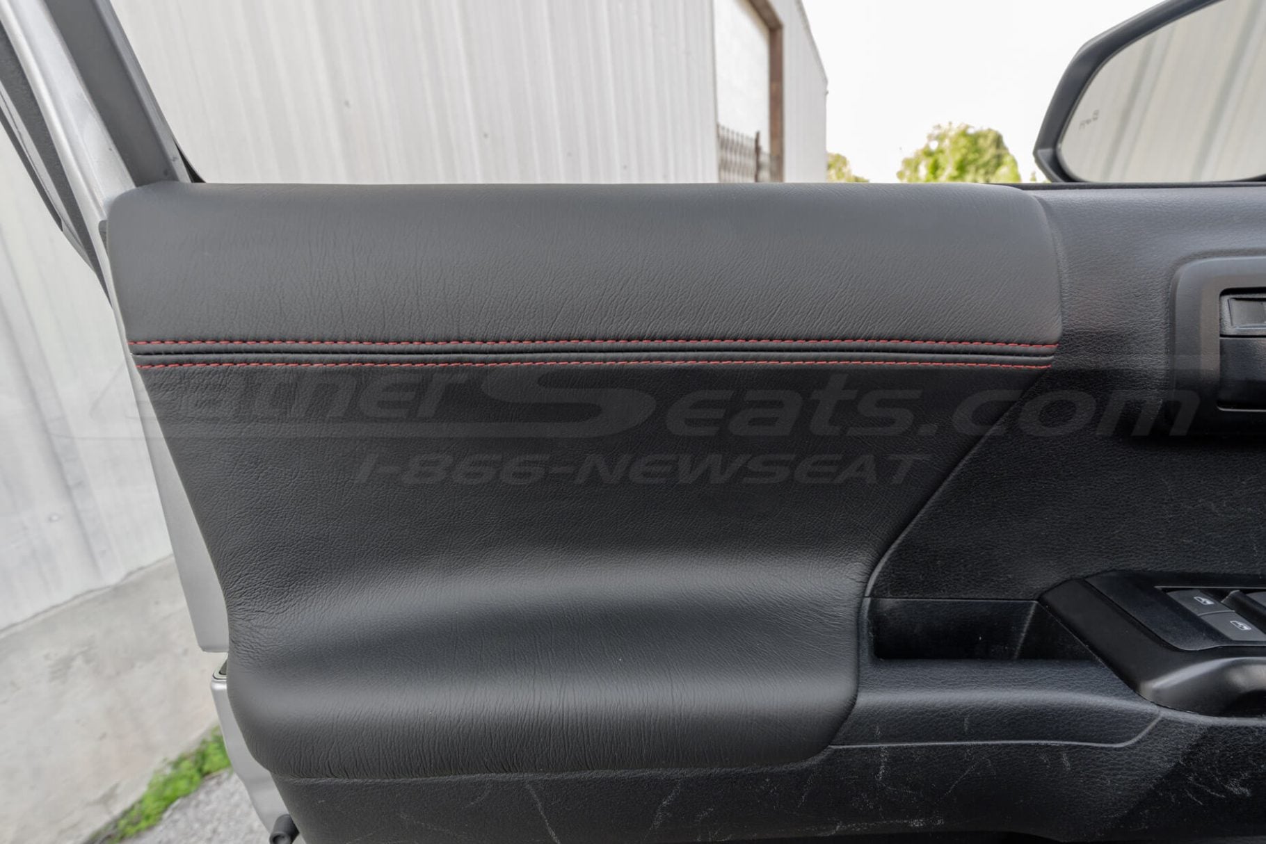 black leather door panels inserts with constrasting red double-stitching
