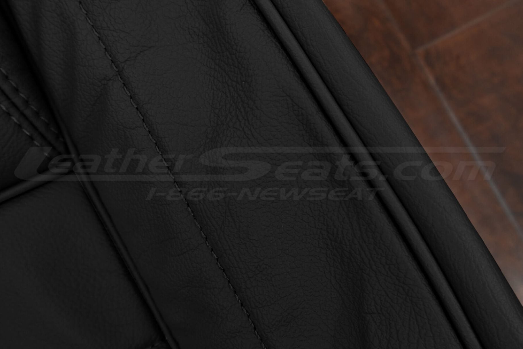 Black piping on matching black leather for grand wagoneer
