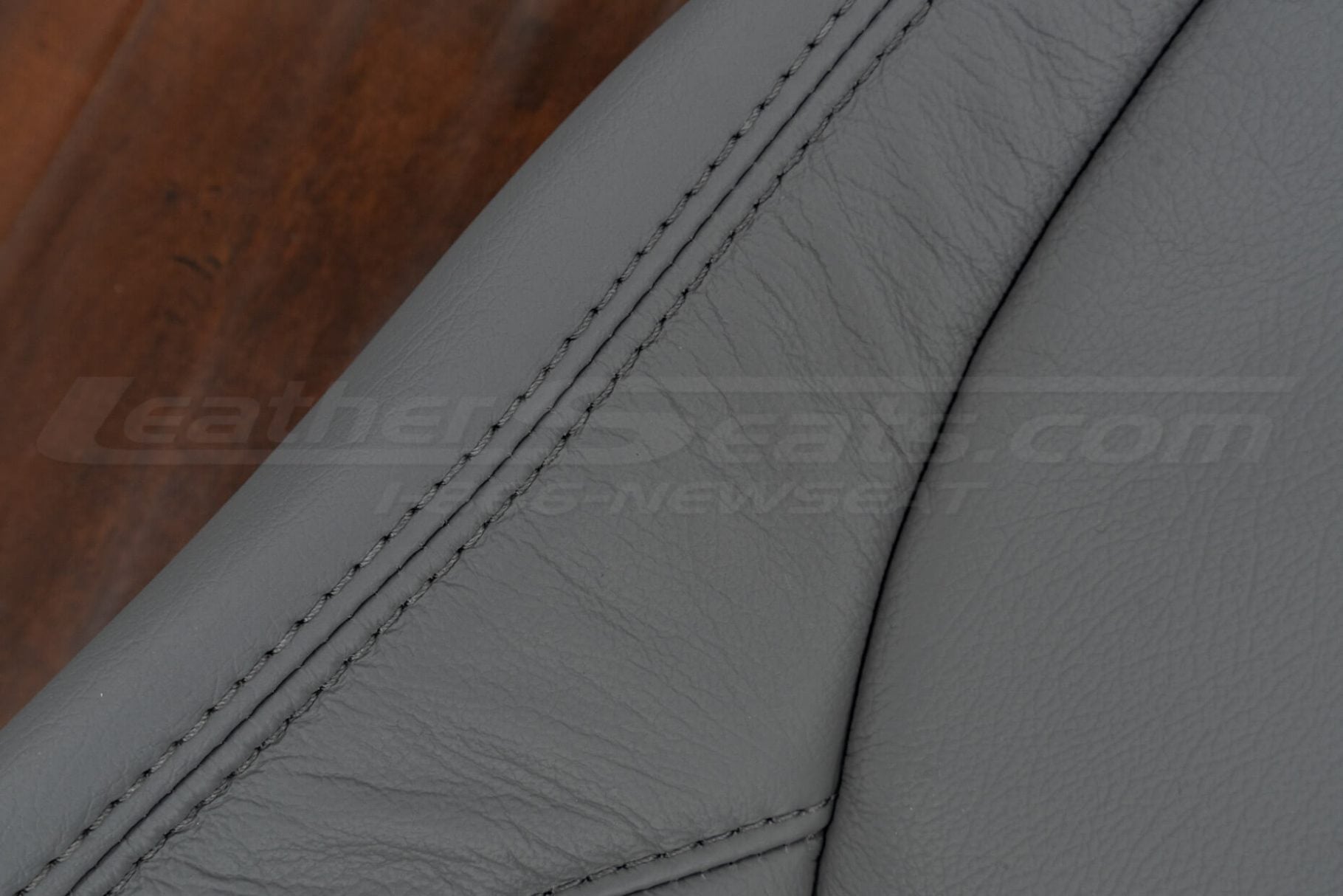 Matching Crater Grey double-stitching on crater-grey leather